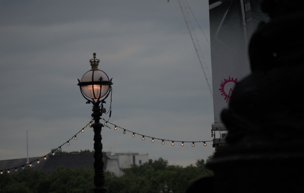 A streetlamp shaped somewhat like the Holy Hand Grenade, with a string of lights tied to its base